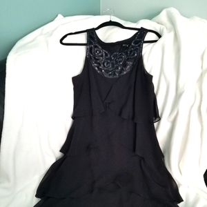 A black, embellished layered dressed.